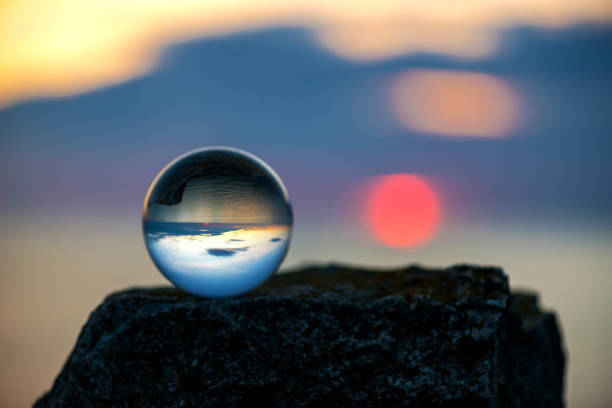 istock Upside down sunset landscape at Cape Kaliakra, Bulgaria, Eastern Europe - reflection in a lensball - selective focus, space for text 1090788738