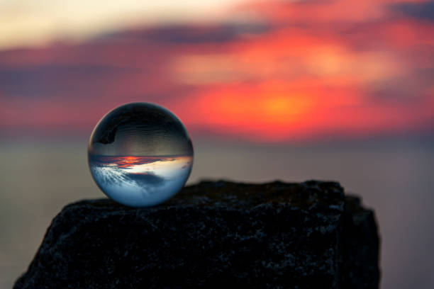 istock Upside down sunset landscape at Cape Kaliakra, Bulgaria, Eastern Europe - reflection in a lensball - selective focus, space for text 1090788760