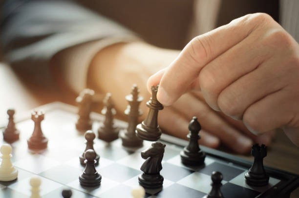 istock business man with chess board game, strategy and competition 1090790776