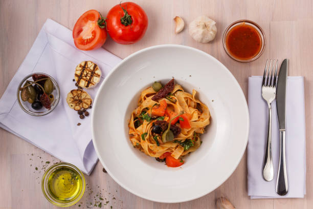 istock Pasta Putanesca on wooden background. 1090790782
