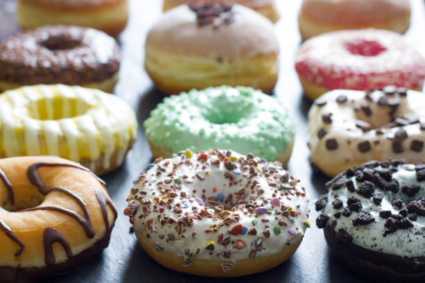 istock Doughnuts donuts various types of cakes abstract fat thursday concept 1090792304