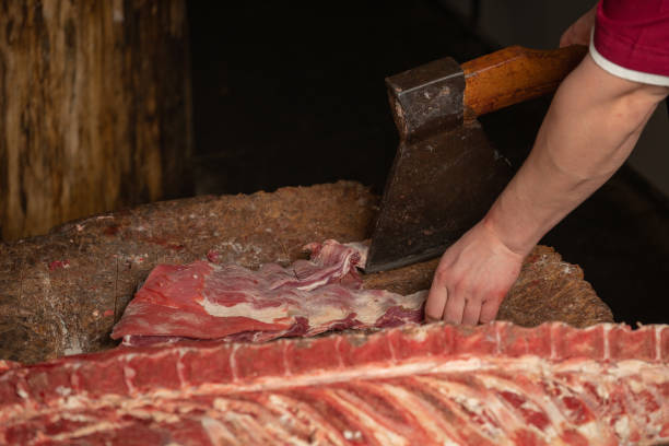 istock a butcher is chopping meat with an axe 1090800238