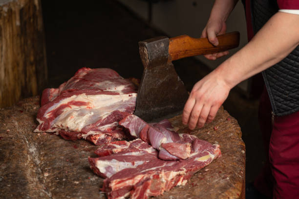 istock a butcher is chopping beef with an axe 1090800354