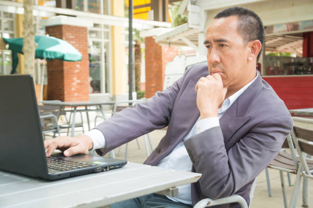 istock Asian Businessman typing on Notebook or Laptop Computer 1090803518