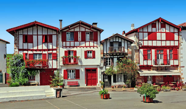 Typical street of the Basque country in France Ainhoa village square lined with traditional houses in southwestern France. french basque country photos stock pictures, royalty-free photos & images