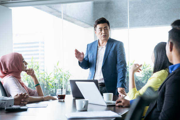 istock Business manager speaking to team in office meeting 1090806580