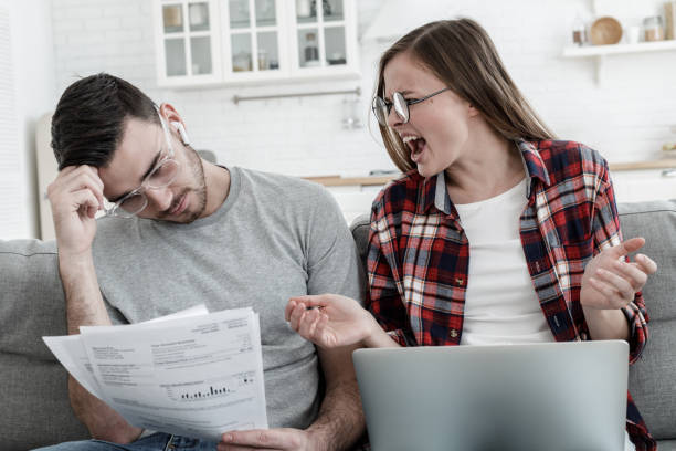istock Lady shouting desperately at man while counting debts for bills, experiencing family economic crisis 1090813216