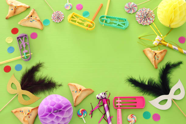 istock Purim celebration concept (jewish carnival holiday) over wooden green background. 1090816080