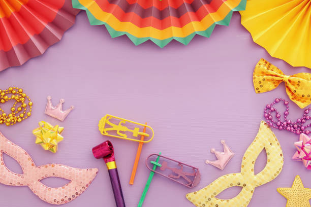 istock Purim celebration concept (jewish carnival holiday) over pink wooden background. Top view. 1090816096