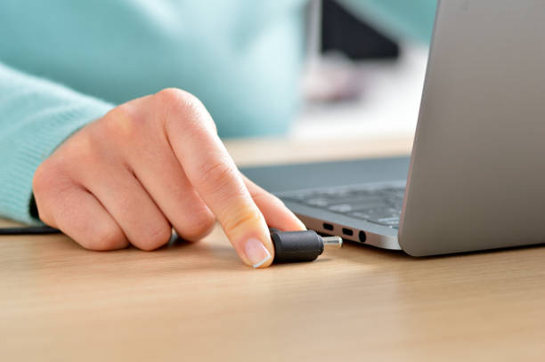 istock connecting my laptop to the electrical network 1090826908