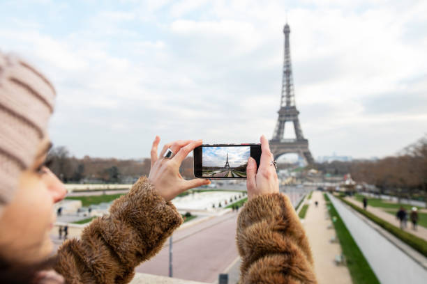 istock Tourist taking photo of Eiffel tower in Paris 1090827178