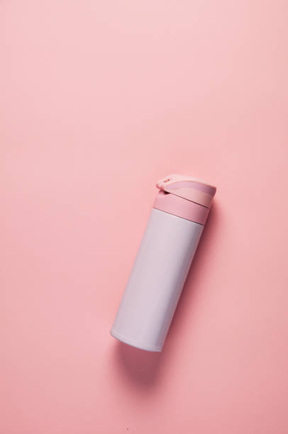 istock Pink thermos on pink background 1090827996