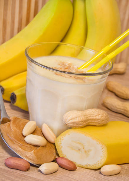 Glass of banana smoothie with peanut butter