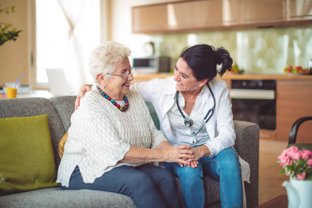 Social worker is visiting a senior woman