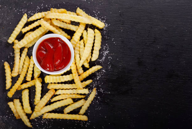 istock French fries with ketchup, top view 1090835136