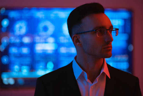 istock The handsome businessman in glasses on the screen background 1090835210