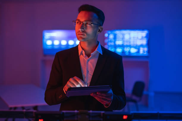 istock The businessman in glasses working with a tablet 1090835700