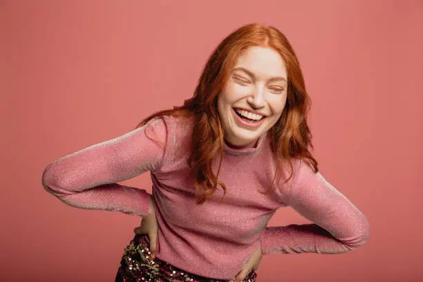 Photo of Portrait of a Laughing Redhead Woman