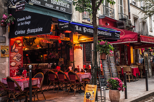 Paris, France - October 9, 2014:  Street scene from the Latin Quarter, Saint-Michel in Paris France with outdoor cafes