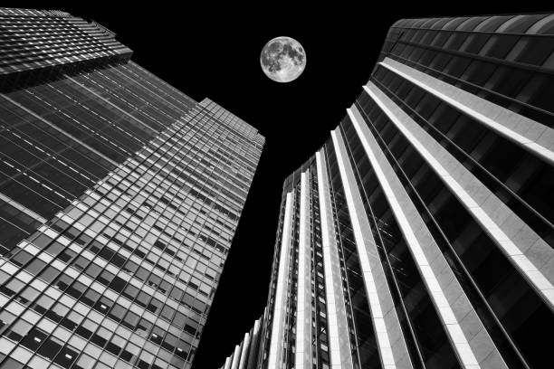 istock Skyscrapers at night with a full moon 1090837508