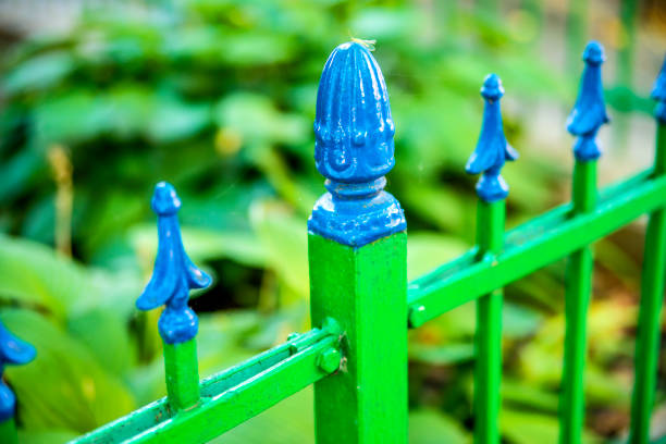 pretty blue and green iron fence