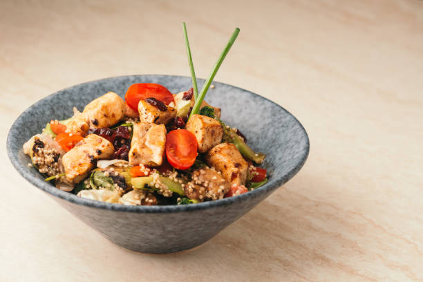 Chicken salad with vegetables and quinoa stock photo