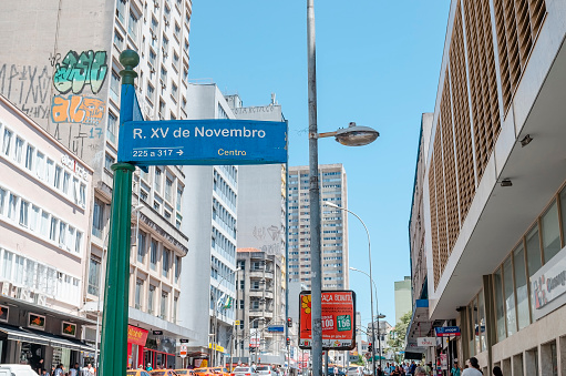 Curitiba - PR, Brazil - December 14, 2018: Street sign of the downtown street XV de Novembro. Plate with the street name. Rua das Flores. Touristic place.