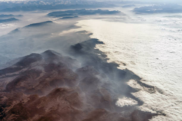 istock Landscape view of Alpine mountains with clouds from the sky 1090851252