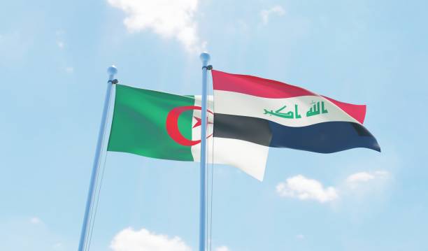 istock Algeria and Iraq, two flags waving against blue sky 1090855044