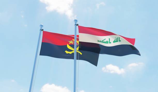 istock Angola and Iraq, two flags waving against blue sky 1090855170