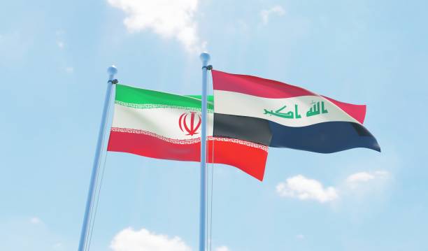 istock Iran and Iraq, two flags waving against blue sky 1090855532
