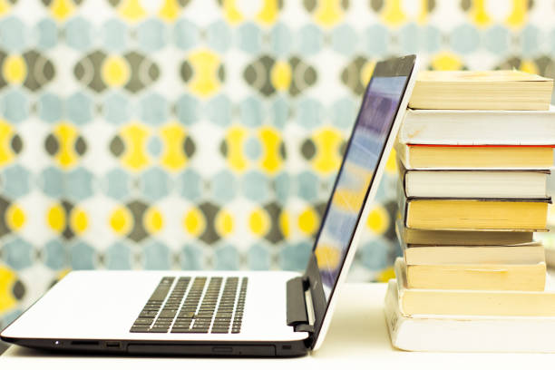 istock Education background with laptop and books 1090861230