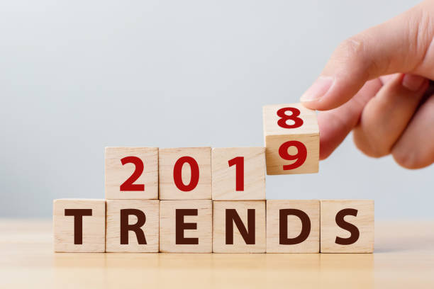 istock 2019 trend concept. Hand flip wood cube change year 2018 to 2019 1090870726