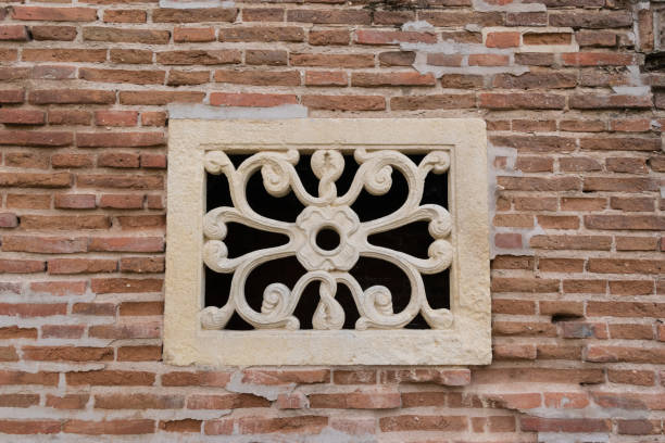istock old concrete wall decoration - flower pattern decorative detail used for a window 1090872340