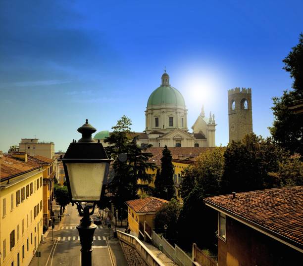 istock Italian cityscape with baroque dome and medieval tower. 1090872934
