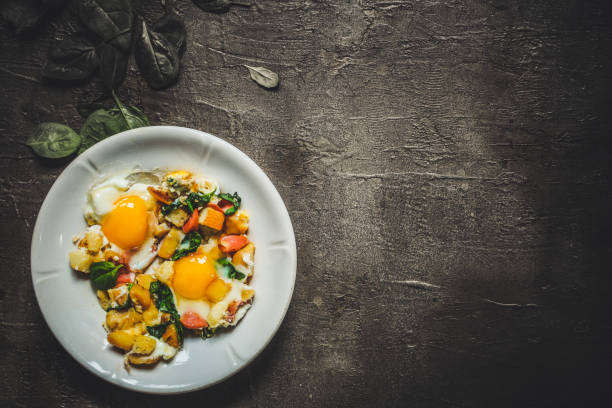 istock Fried eggs with spinach, sausage and breadcrumbs - healthy breakfast (quick meal). Top view. copy space 1090877726