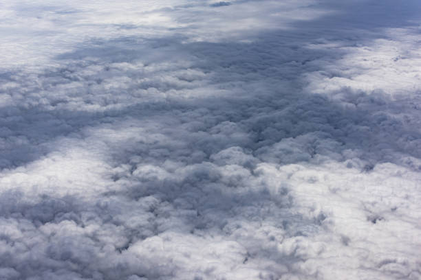 istock cloud and sky view from window of airplane 1090879868