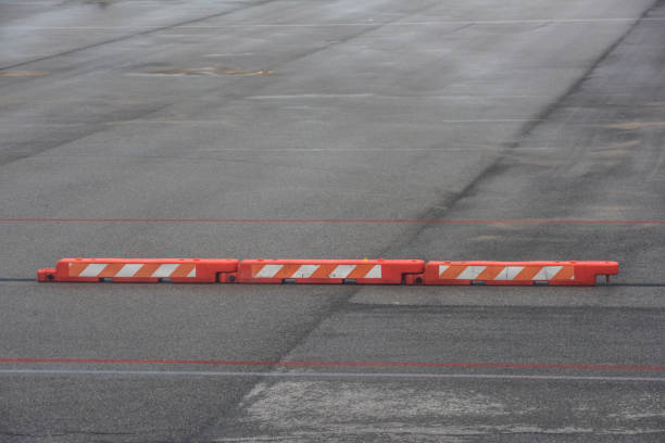 istock traffic barrier on asphalt road 1090879898