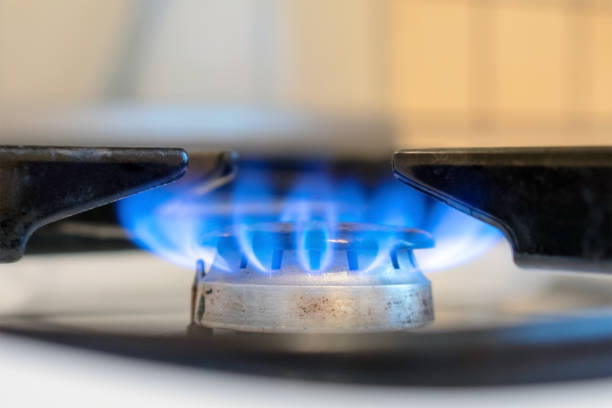 istock Old kitchen stove cook with blue flames burning. Can be a source of fire or explosion. Household gas stove. In kitchen room. 1090881254