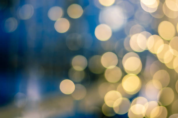 istock Abstract yellow blue light bokeh background for Christmas, Birthday, anniversary refocused blurred background. 1090882264
