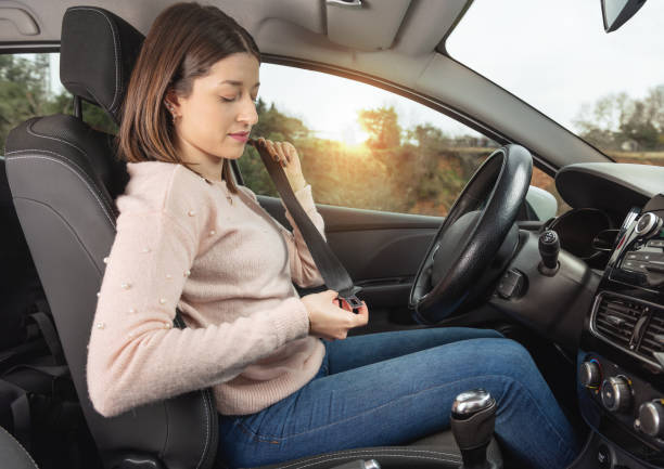 istock Woman fastening her seatbelt 1090882658