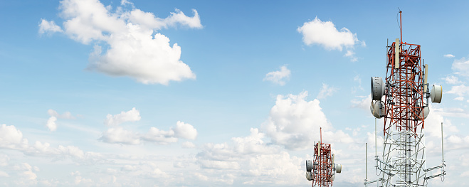 Signal tower for communication industrial on blue sky background