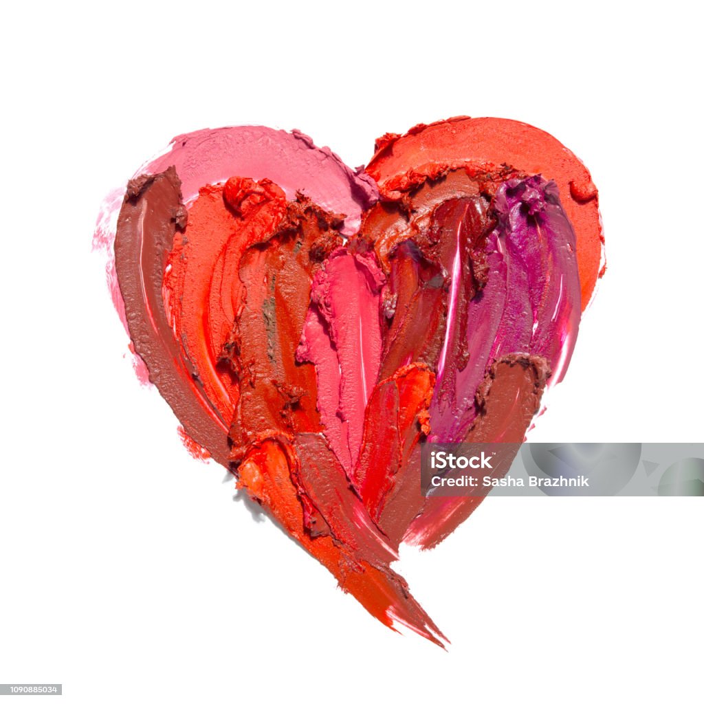 Beauty Love swatches. Creative concept photo of cosmetics swatches in the shape of heart love  on white background. Make-Up Stock Photo