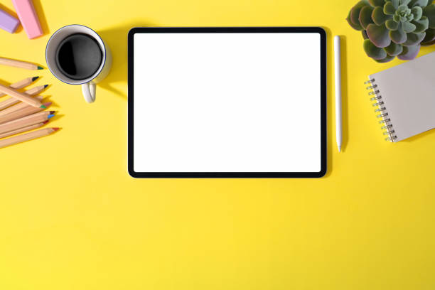 istock Office creative yellow desk with supplies and copy space 1090890978