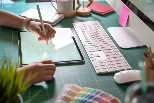 istock Graphic designer working with digital drawing tablet at her office 1090892068