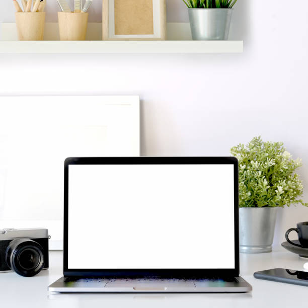 istock Modern office workplace with blank screen tablet mockup, pc and stylish supplies on the office desk. 1090895878