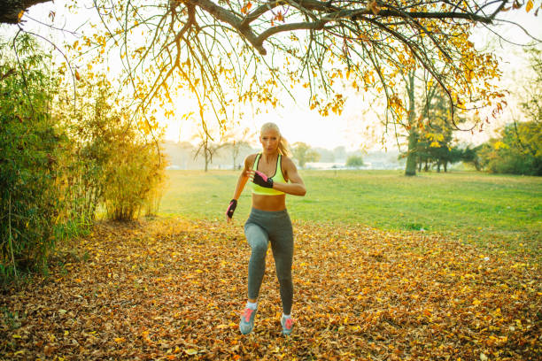 istock Sexy blonde running in the park 1090901864