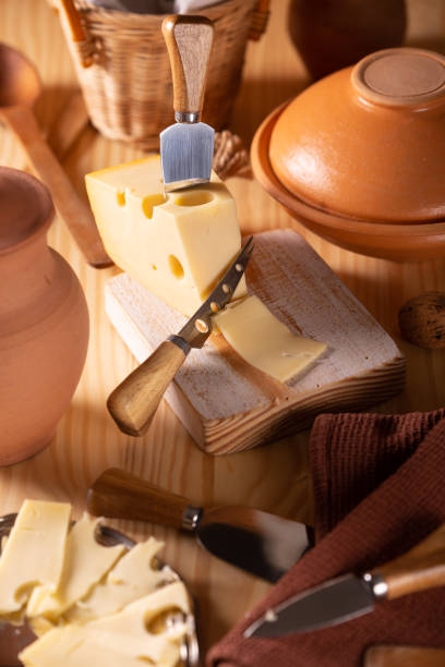 istock Piece of fresh tasty cheese on the kitchen table 1090903536
