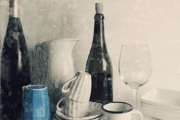 Close-up of crockery and bottles, wall in the background