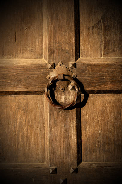 istock Old wooden door with a ring-shaped handle 1090907838